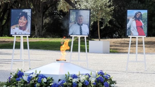This picture taken on November 7, 2020, in Nice, during a ceremony shows the portraits of the three victims of an attack at Notre-Dame de Nice Basilica on October 29, 2020, (fromL) Nadine Devillers, Vincent Loques and Simone Barreto Silva. (AFP)