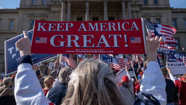 Supporters of US President Donald Trump rally at the State Capitol in Lansing, Michigan, on November 7, 2020, after Democratic Presidential nominee Joe Biden was declared the winner of the 2020 US elections. SETH HERALD / AFP