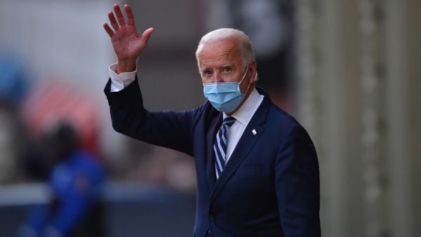 US President-elect Joe Biden waves as he leaves The Queen in Wilmington, Delaware, on November 10, 2020. President-elect Joe Biden said November 10, 2020 he had told several world leaders that "America is back" after his defeat of Donald Trump in last week's bitterly contested US election. Angela Weiss / AFP