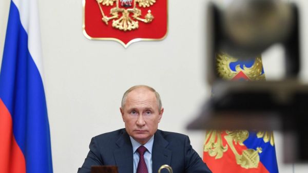 Russian President Vladimir Putin looks on during a meeting with members of the government via teleconference call at Novo-Ogaryovo state residence, outside Moscow, on November 18, 2020. Alexey NIKOLSKY / Sputnik / AFP