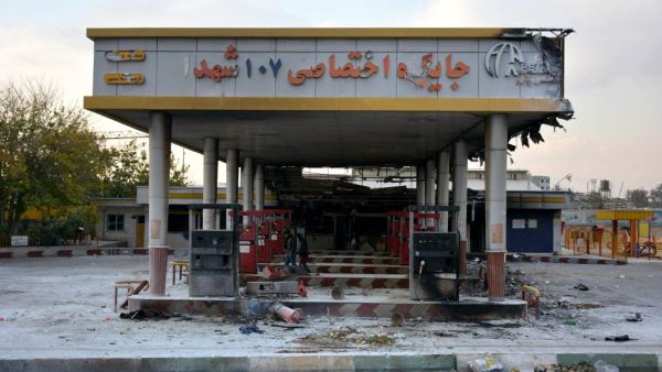  This file photo taken on November 17, 2019 shows a scorched gas station that was set ablaze by protesters during a demonstration against a rise in gasoline prices in Eslamshahr, near the Iranian capital of Tehran. One year after protests harshly suppressed by the Iranian authorities, grief over the hundreds of mainly young lives lost is matched by anger over the lack of accountability over a crackdown whose scale is only beginning to emerge. AFP