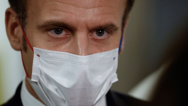 French President Emmanuel Macron listens during a visit to the 2020 Phoneton, an annual fundraising operation organised by the Hayastan All-Armenian Fund's French affiliate (Fonds Armenien de France) for the development of Armenia and Artsakh, on November 21, 2020 in Paris. Ludovic MARIN / POOL / AFP