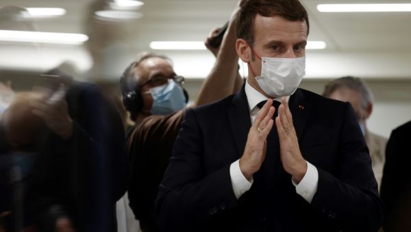 French President Emmanuel Macron speaks to volunteers during the 2020 Phoneton, an annual fundraising operation organised by the Hayastan All-Armenian Fund's French affiliate (Fonds Armenien de France) for the development of Armenia and Artsakh, on November 21, 2020 in Paris. Ludovic MARIN / POOL / AFP