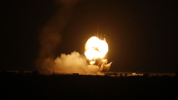 Flames are seen following an Israeli air strike in the town of Khan Yunis, in the southern Gaza Strip, early on November 22, 2020. AFP