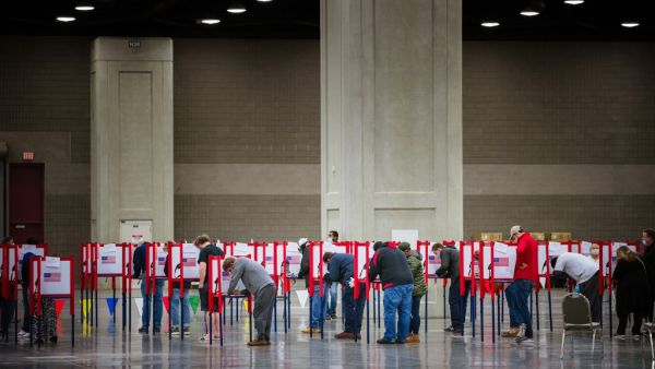  Voters stand in ballot boxes at the Kentucky Exposition Center on November 3, 2020 in Louisville, Kentucky. After a record-breaking early voting turnout, Americans head to the polls on the last day to cast their vote for incumbent U.S. President Donald Trump or Democratic nominee Joe Biden in the 2020 presidential election. Jon Cherry/Getty Images/AFP