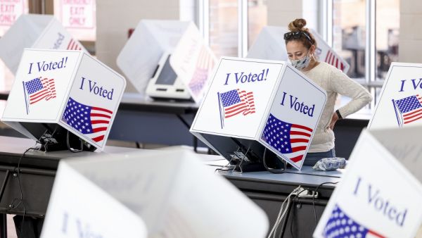 Americans head to the polls on the last day to cast their vote for incumbent U.S. President Donald Trump or Democratic nominee Joe Biden in the 2020 presidential election. Michael Ciaglo/Getty Images/AFP