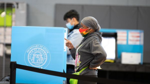  A Gwinnett county voter casts a ballot at Lucky Shoals Park polling station on November 3, 2020 in Norcross, Georgia. After a record-breaking early voting turnout, Americans head to the polls on the last day to cast their vote for incumbent U.S. President Donald Trump or Democratic nominee Joe Biden in the 2020 presidential election. Jessica McGowan/Getty Images/AFP