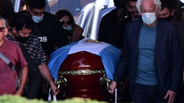 He died in his sleep at noon while resting at his home in Tigre, Buenos Aires, Argentina, on Wednesday. Pictured, Maradona's coffin. (AFP)