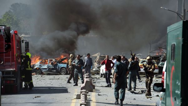 Security forces arrive at the site of a car bomb attack in Kabul. —AFP