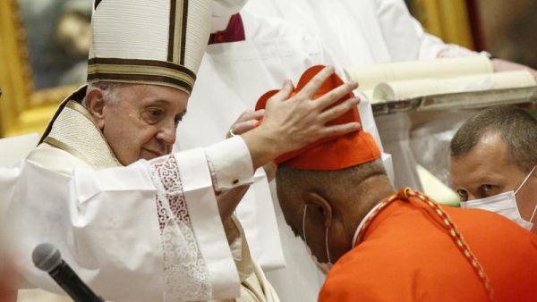 Archbishop Wilton Gregory of Washington, D.C., becomes a cardinal during a ceremony Saturday known as a consistory in St. Peter's Basilica at the Vatican. Pope Francis cautioned new cardinals never to lose their connection to the people. Fabio Frustaci/Pool/AFP via Getty Images