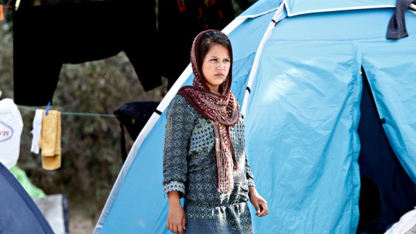 Refugees and migrants rest in at a makeshift camp at Pedion tou Areos park where some 1500 migrants and refugees live in a makeshift camps in Athens, Greece. (Shutterstock/ File Photo)