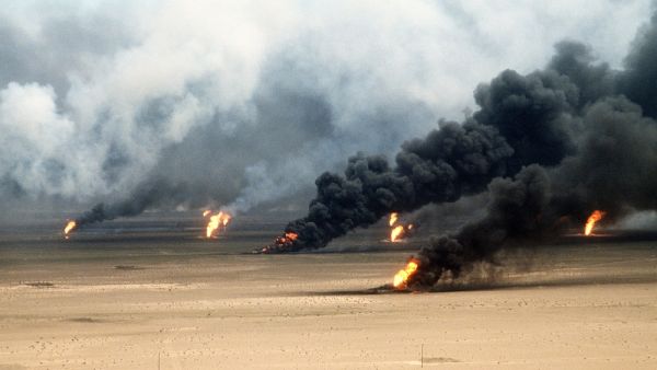 Oil well fires rage outside Kuwait City in the aftermath of the First Gulf War (Shutterstock)