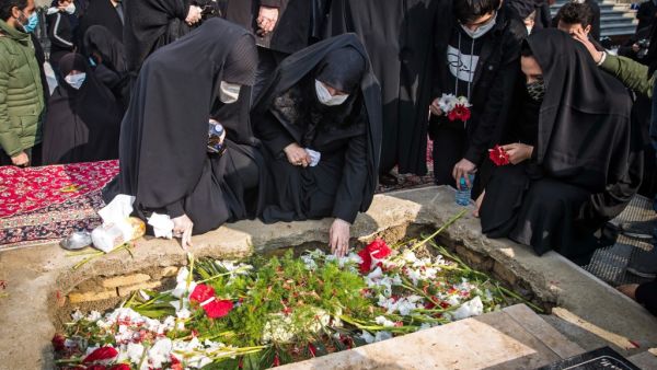 Iranian mourners attend the burial ceremony of slain nuclear scientist Mohsen Fakhrizadeh at Imamzadeh Saleh shrine in northern Tehran, on November 30, 2020. HAMED MALEKPOUR / TASNIM NEWS / AFP
