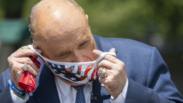 Donald Trump on December 6, 2020 tweeted that his personal lawyer Rudy Giuliani, who has led the president's effort to undo his election loss, tested positive for Covid-19. JIM WATSON / AFP