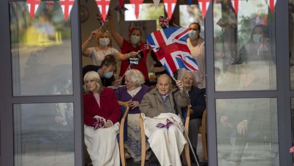 Residents wait to greet Britain's Catherine, Duchess of Cambridge and Britain's Prince William, Duke of Cambridge as they visit Cleve Court Care Home in Bath in south west England to pay tribute to the efforts of care home staff throughout the COVID-19 pandemic. (AFP/File)