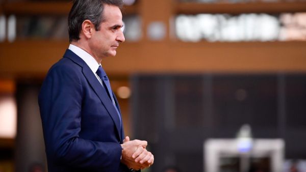 Greece's Prime Minister Kyriakos Mitsotakis speaks to the press as he arrives at the EU headquarters' Europa building in Brussels on December 10, 2020, prior to a European Union summit. JOHN THYS / POOL / AFP