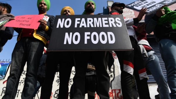 Farmers participate in a demonstration against the central government's recent agricultural reforms at the Delhi-Haryana state border in Singhu on December 13, 2020. Sajjad HUSSAIN / AFP Farmers participate in a demonstration against the central government's recent agricultural reforms at the Delhi-Haryana state border in Singhu on December 13, 2020. Sajjad HUSSAIN / AFP