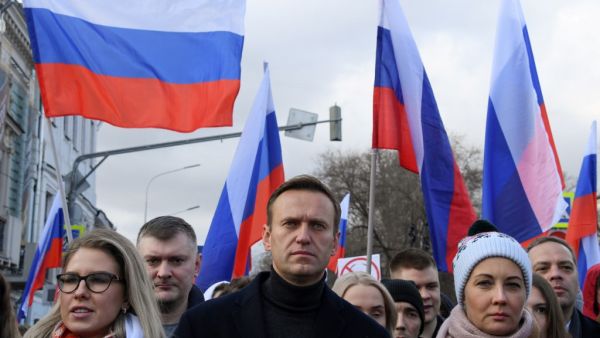  In this file photo taken on February 29, 2020 Russian opposition leader Alexei Navalny, his wife Yulia, opposition politician Lyubov Sobol and other demonstrators take part in a march in memory of murdered Kremlin critic Boris Nemtsov in downtown Moscow on February 29, 2020. Navalny, 44, was hospitalised in the Russian city of Omsk after he collapsed on a flight from Siberia to Moscow in August 2020 and then transported by medical aircraft to Berlin. Chemical weapons experts from Russia's Federal Security 
