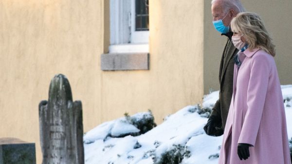 US President-elect Joe Biden and his wife Jill Biden leave St. Joseph on the Brandywine Roman Catholic Church after morning mass in Wilmington, Delaware on December 18, 2020. Biden lost his first wife Neilia and daughter Naomi in a car accident on this date in 1972. ALEX EDELMAN / AFP