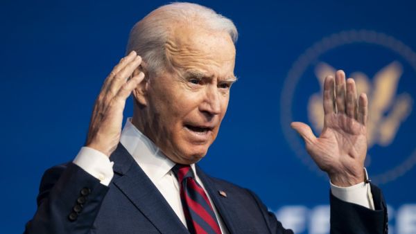 US President-elect Joe Biden speaks during an event to introduce key Cabinet nominees and members of his climate team at The Queen Theater in Wilmington, Delaware on December 19, 2020. ALEX EDELMAN / AFP