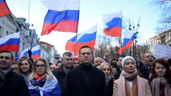  In this file photo taken on February 29, 2020 Russian opposition leader Alexei Navalny, his wife Yulia, opposition politician Lyubov Sobol and other demonstrators march in memory of murdered Kremlin critic Boris Nemtsov in downtown Moscow. Russian investigators on December 29, 2020, opened a criminal probe into Kremlin critic Alexei Navalny, alleging he spent more than 356 million rubles ($4.8 million) of donations to his organisations on personal acquisitions. Kirill KUDRYAVTSEV / AFP