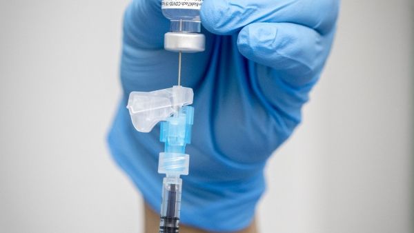 A healthcare worker prepares an injection of the Pfizer-BioNTech Covid-19 vaccine at St James's Hospital in Dublin on December 29, 2020. Ireland kicked off on December 29 its coronavirus vaccination programme with staff and pateints at four hospitals across the Republic being the first to recieve injections from the first delivery of 10,000 doses received by the Health Authorty on December 26. Marc O'Sullivan / POOL / AFP
