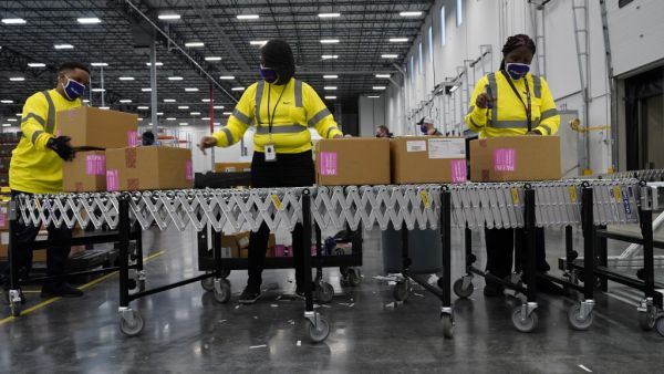 Boxes containing the Moderna COVID-19 vaccine are prepared to be shipped at the McKesson distribution center on December 20, 2020 in Olive Branch, Mississippi. The federal government plans to distribute over the coming week a total of 7.9 million doses of vaccines from Moderna and Pfizer Inc. Paul Sancya - Pool/Getty Images/AFP POOL / GETTY IMAGES NORTH AMERICA / Getty Images via AFP