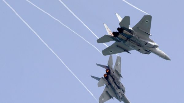 Israeli F-15 fighter jets rehearsing in Tel Aviv on Thursday for an air show to commemorate the 70th anniversary of the creation of Israel next month. Photo: AFP