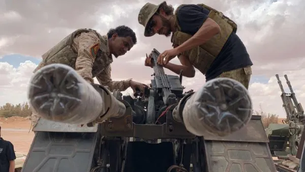 Troops loyal to Libya’s GNA prepare their weapons as they carry out patrols near Abu Qareen, Libya September 15. (AFP)