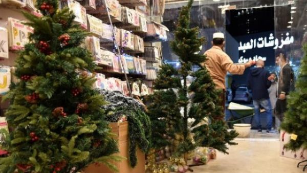 Expats living in Saudi Arabia choose Christmas decorations at a gift shop in the capital Riyadh on December 7, 2020. For decades, Christmas sales were largely underground, and Christians from the Philippines, Lebanon and other countries celebrated behind closed doors or in expat enclaves. (AFP)