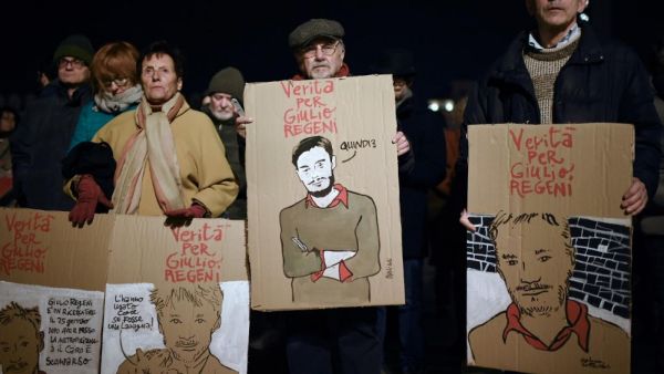 Activists of human rights organisation Amnesty International take part in a demonstration in Piazza Castello in Turin on 25 January (AFP/File photo)