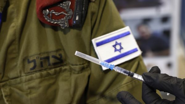 An Israeli military medic prepares to administer the Pfizer-BioNTech COVID-19 vaccine at the medical centre of Tzrifin military base in the Israeli town of Rishon Lezion on December 28, 2020. JACK GUEZ / AFP