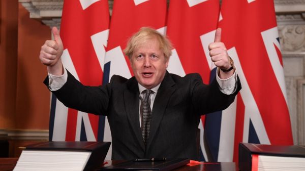 In this file photo taken on December 30, 2020 Britain's Prime Minister Boris Johnson gives a double thumbs up after signing the Trade and Cooperation Agreement between the UK and the EU, the Brexit trade deal, at 10 Downing Street in central London. Leon Neal / POOL / AFP