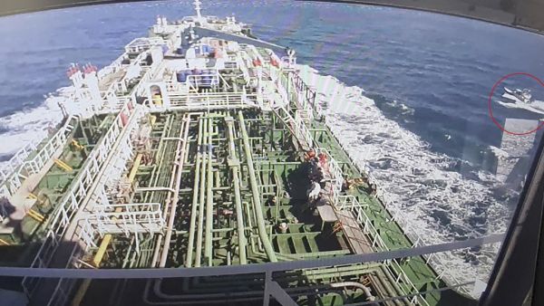 A CCTV footage of the Hankuk Chemi, a South Korean-flagged oil tanker, is displayed on a screen as a boat of Iran's Revolutionary Guards is seen in red circle on the screen at the tanker's owner company DM Shipping, in Busan on January 4, 2021. South Korea's foreign ministry on January 4 demanded the "early release" of an oil tanker seized by Iran in Gulf waters for breaking maritime environmental laws. YONHAP / AFP