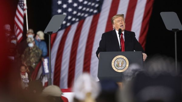 US President Donald Trump speaks during a rally in support of Republican incumbent senators Kelly Loeffler and David Perdue ahead of Senate runoff in Dalton, Georgia on January 4, 2021. SANDY HUFFAKER / AFP