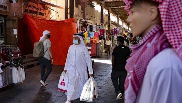 Emiratis shop at the Dubai grand market, in the Gulf city of Dubai, on January 6, 2021. Karim SAHIB / AFP