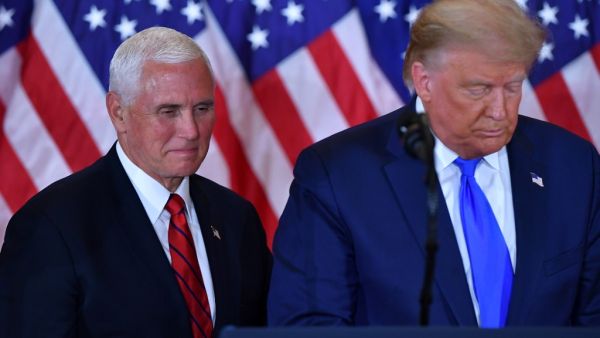In this file photo US President Donald Trump and US Vice President Mike Pence(L) speak during election night in the East Room of the White House in Washington, DC, early on November 4, 2020. MANDEL NGAN / AFP