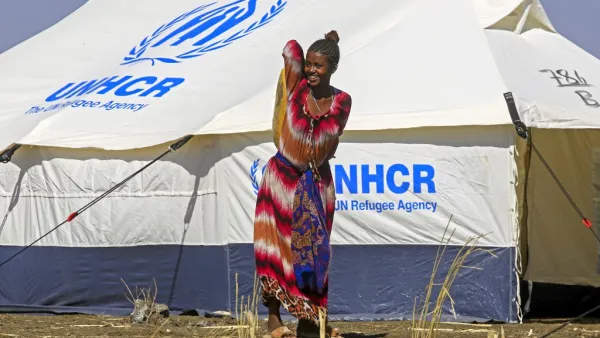 An Ethiopian refugee, who fled the Tigray conflict, walks in the Tenedba camp in Mafaza, eastern Sudan on January 8, 2021, after being transported from the reception center. ASHRAF SHAZLY / AFP