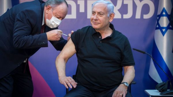 Israeli Prime Minister Minister Benjamin Netanyahu receives the second dose of the coronavirus disease (COVID-19) vaccine at Sheba Medical Center in Ramat Gan, near the coastal city of Tel Aviv, on January 9, 2021. Miriam ALSTER / POOL / AFP