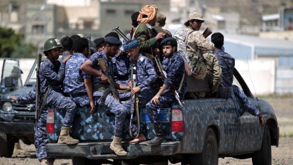 In this file photo taken on September 17, 2019, Yemeni Shiite Huthi police forces sit in the back of a military vehicle in the capital Sanaa during a protest against the Saudi intervention in their country. MOHAMMED HUWAIS / AFP