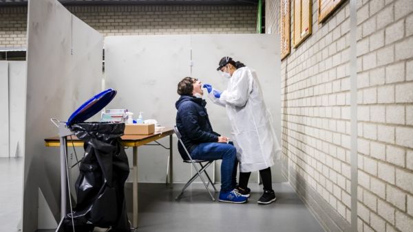 A resident of the Lansingerland municipality gets tested for the Covid-19 in Bergschenhoek, on January 13, 2021, as the UK variant of the disease has been detected. Remko de Waal / ANP / AFP