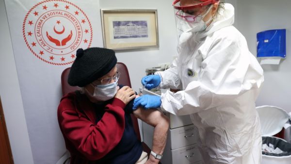An elderly woman receives an injection of the CoronaVac vaccine at a nursing home in Ankara, on January 19, 2021, amid the Covid-19 pandemic caused by the novel coronavirus. Adem ALTAN / AFP