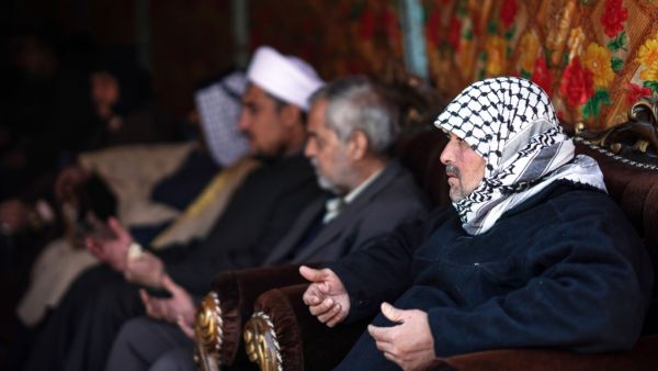 People console Louai al-Nuaimi (R), father of two Iraqi youngsters, Omar and Ali, killed in Baghdad's twin suicide attacks, during a condolences ceremony in the capital's Cairo neighbourhood, on January 22, 2021. Twin suicide blasts in Baghdad claimed by the Islamic State group have exposed gaps within Iraq's security forces, weakened by the COVID-19 pandemic, rival armed groups and political tensions. Ayman HENNA / AFP People console Louai al-Nuaimi (R), father of two Iraqi youngsters, Omar and Ali, killed in Baghdad's twin suicide attacks, during a condolences ceremony in the capital's Cairo neighbourhood, on January 22, 2021. Twin suicide blasts in Baghdad claimed by the Islamic State group have exposed gaps within Iraq's security forces, weakened by the COVID-19 pandemic, rival armed groups and political tensions. Ayman HENNA / AFP