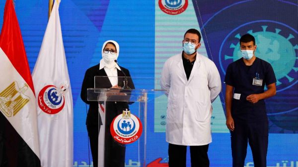 (L to R) Egyptian Health Minister Hala Zayed gives a press conference, accompanied by doctor Abdelmouim Selem and medical staff member Ahmed Hemdan, in a tent set up outside the Abou Khalifa hospital, in Ismailia, about 120kms east the capital Cairo, on January 24, 2021, after the two men received a dose of a coronavirus vaccine. Egypt began its nationwide Covid-19 immunisation program today, with a doctor and a nurse receiving the Chinese-made Sinopharm jab. Khaled DESOUKI / AFP