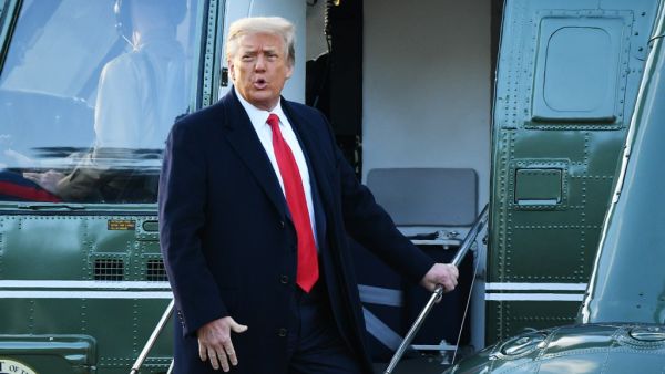 this file photo taken on January 20, 2021 outgoing US President Donald Trump boards Marine One at the White House in Washington, DC. MANDEL NGAN / AFP