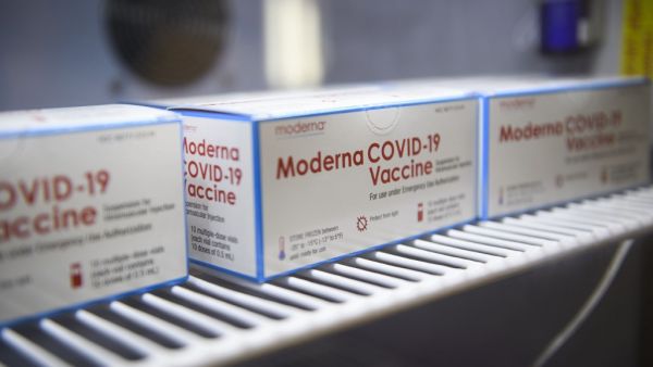 Boxes containing vials of the Moderna Covid-19 vaccine are stored at the Kedren Community Health Center on January 25, 2021 in Los Angeles, California. While vaccination priority is given to people including healthcare workers and the elderly, some outside the priority tiers are waiting in line to potentially receive a dose that needs to be administered before it expires and goes to waste. Patrick T. FALLON / AFP