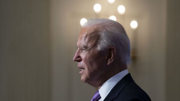 U.S. President Joe Biden speaks about the coronavirus pandemic in the State Dining Room of the White House on January 26, 2021 in Washington, DC. President Biden said his administration has secured commitments from vaccine makers Pfizer and Moderna to purchase another 200 million doses that will arrive this summer. Doug Mills-Pool/Getty Images/AFP POOL / GETTY IMAGES NORTH AMERICA / Getty Images via AFP