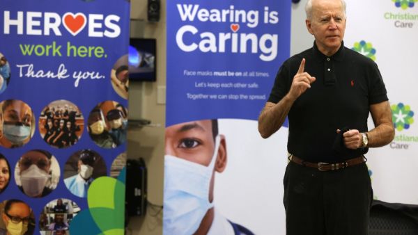 President-elect Joe Biden speaks to the press after receiving his second dose of the Pfizer/BioNTech COVID-19 vaccination at ChristianaCare Christiana Hospital on January 11, 2021 in Newark, Delaware. Biden received the second dose of the coronavirus vaccine three weeks after his first dose, received a few days before Christmas. Alex Wong/Getty Images/AFP