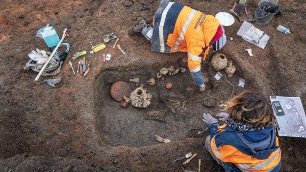 French archeologists dig at an ancient child burial site recent at the Clermont-Ferrand Airport. France's National Institute of Preventive Archaeological Research said Thursday the site dates back 2,000 years. (Photo courtesy of National Institute of Preventive Archaeological Research Twitter)