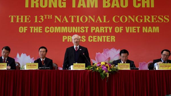 Vietnam's newly elected Communist Party general secretary Nguyen Phu Trong (C) takes part in a press conference after the closing ceremony of the Communist Party of Vietnam (CPV) 13th National Congress at the National Convention Centre in Hanoi on February 1, 2021. Nhac NGUYEN / AFP